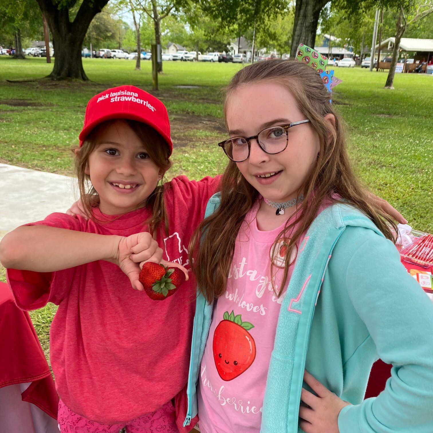Kids working strawberry booth